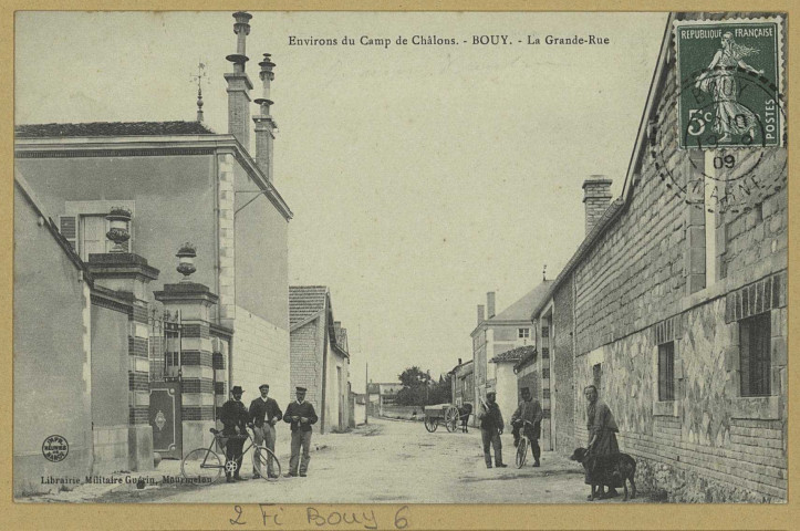 BOUY. Environs du camp de Châlons-Bouy-La Grande Rue.
MourmelonLib. Militaire Guérin (54 - Nancyimp. Réunies de Nancy).[vers 1909]